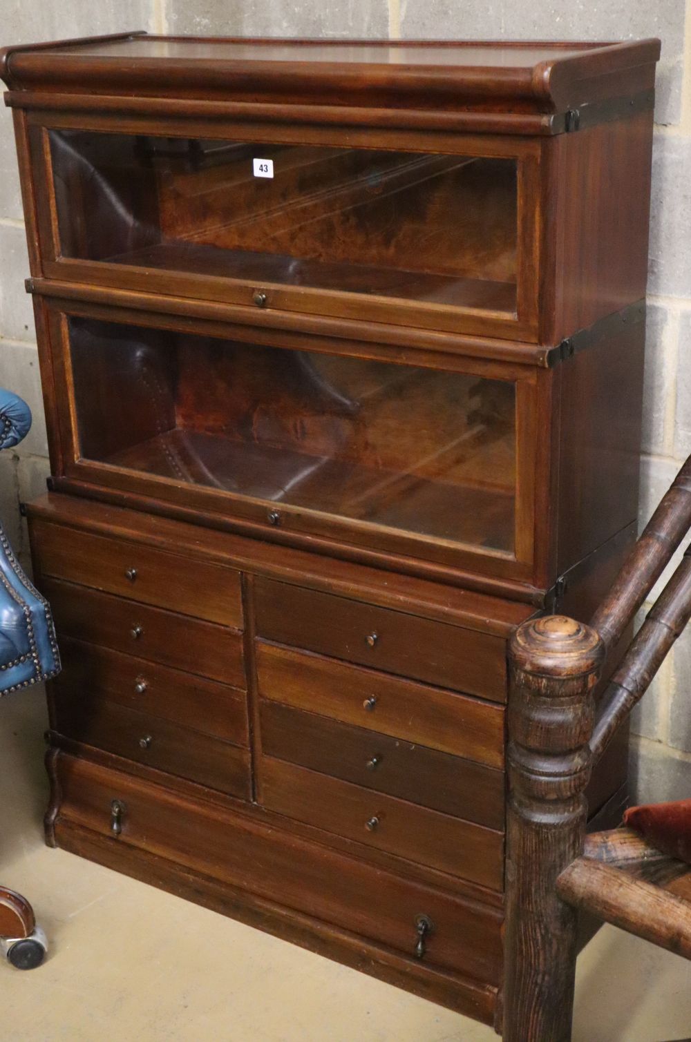 A Globe Wernicke mahogany two section bookcase with eight drawer base section, on plinth base, W.86cm, D.36cm, H.125cm